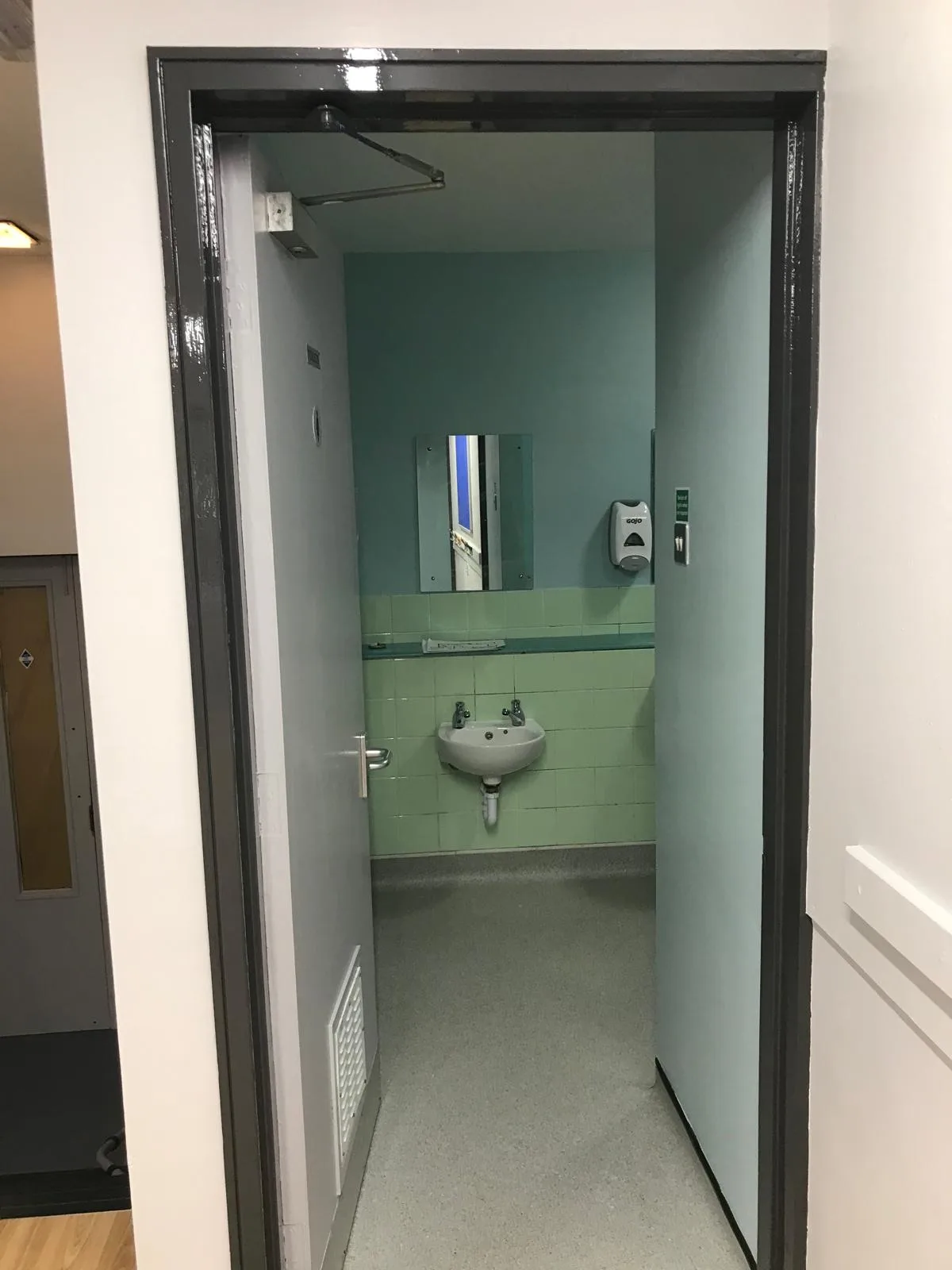 Two Mile Ash Community Centre — Washroom walls painted in calming teal