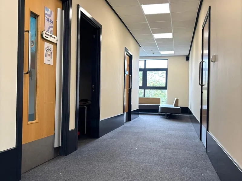Rickley Park School — Vibrant yellow corridor with dark trim