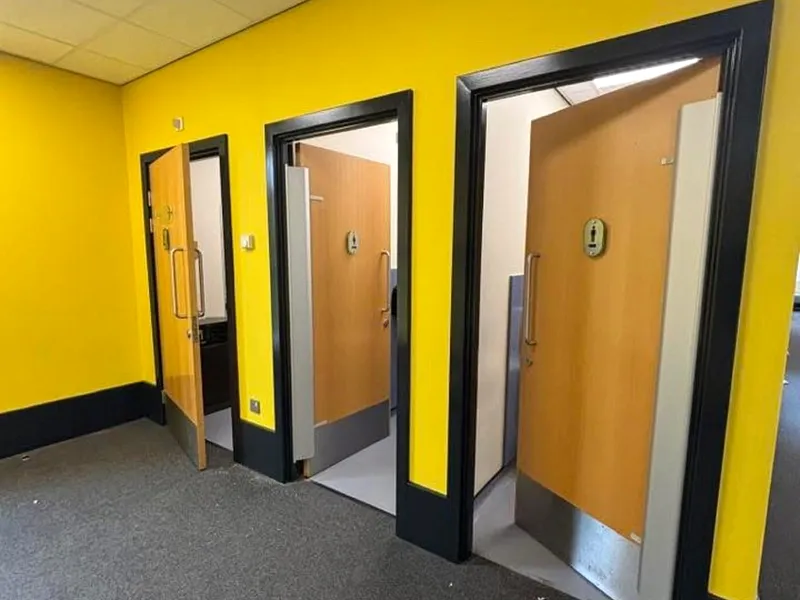 Rickley Park School — Corridor doorways with bold colour scheme