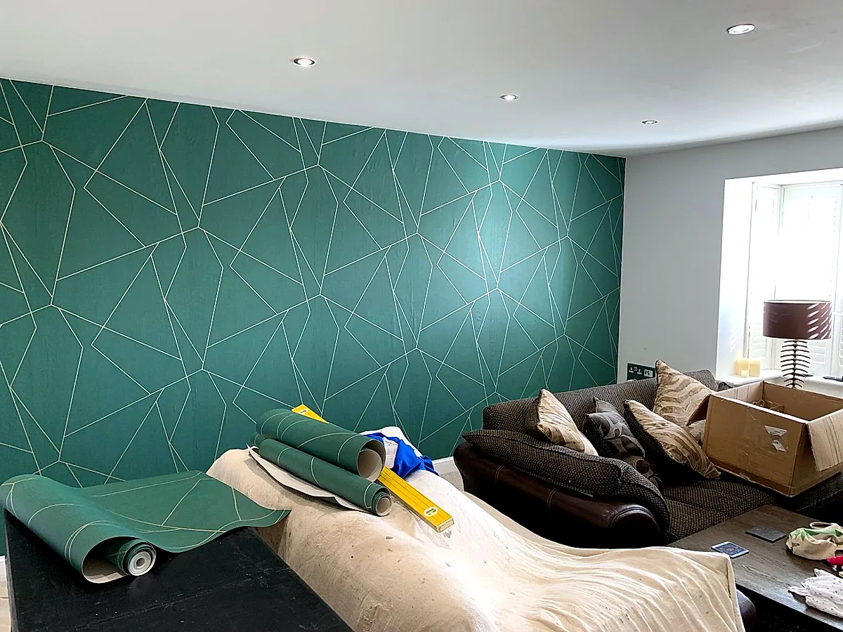 Brooklands — Teal geometric feature wall in living room